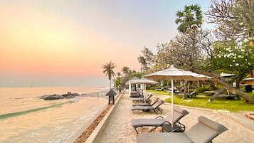 On the beach, sun loungers, beach umbrellas, beach bar