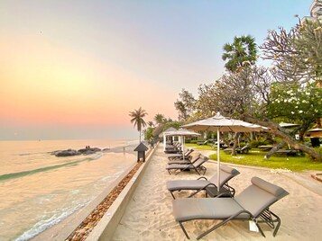 On the beach, sun loungers, beach umbrellas, beach bar