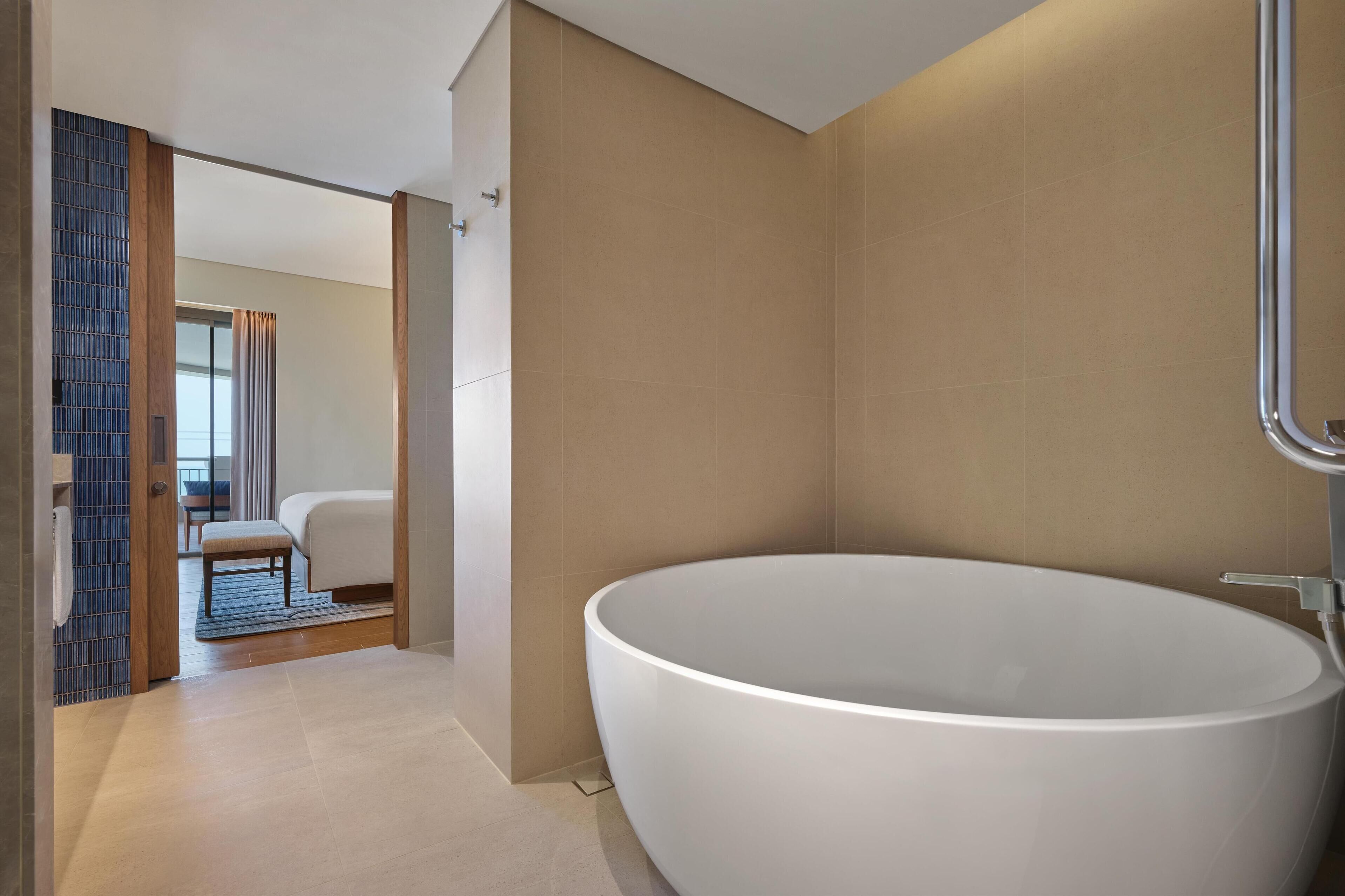Suite, 1 King Bed, Club lounge access, Oceanfront | Bathroom | Free toiletries, hair dryer, bathrobes, slippers