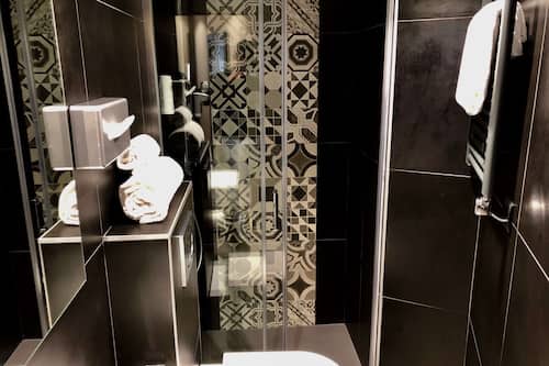 Designer toiletries, hair dryer, towels, soap