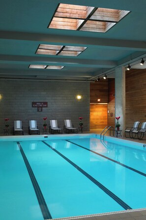 Relax by the pool with lounge chairs and towels at hand.
