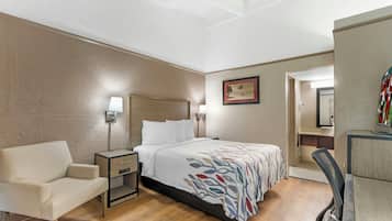 Premium bedding, desk, laptop workspace, blackout drapes