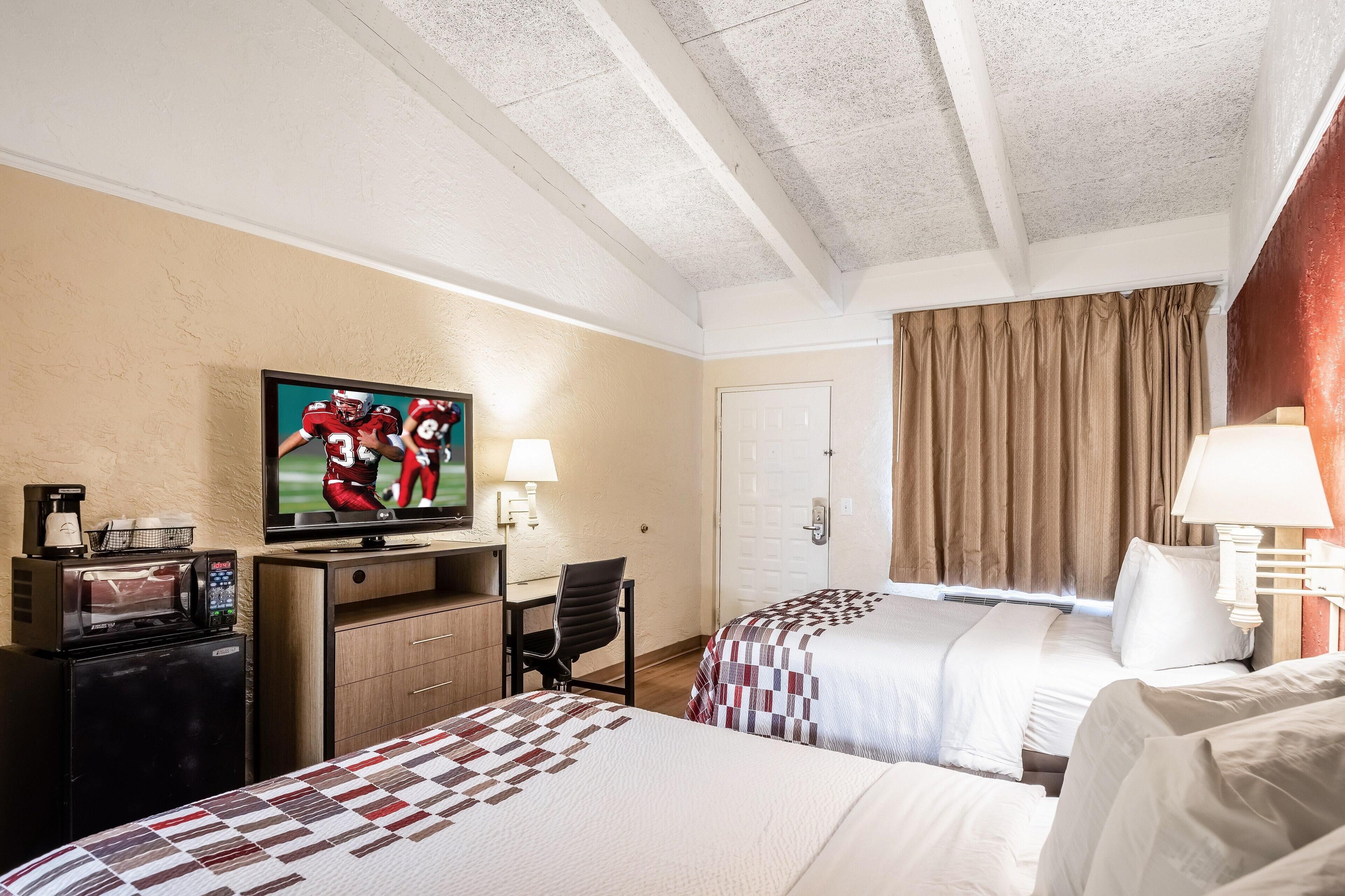 Premium bedding, desk, laptop workspace, blackout curtains