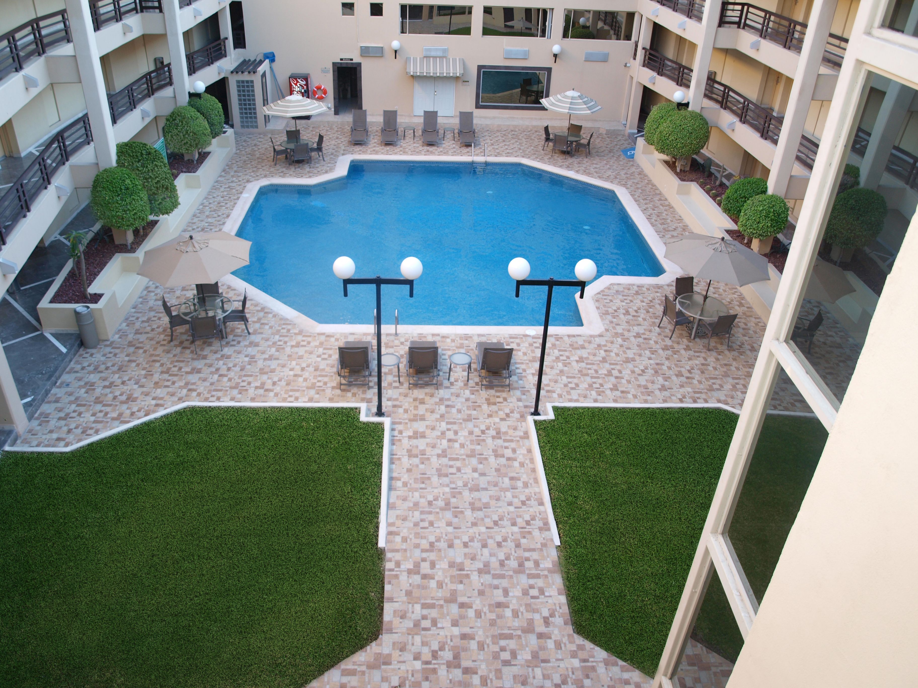 outdoor pool, pool umbrellas, pool loungers