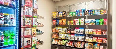 A snack and beverage section with shelves stocked with various snacks and drinks.