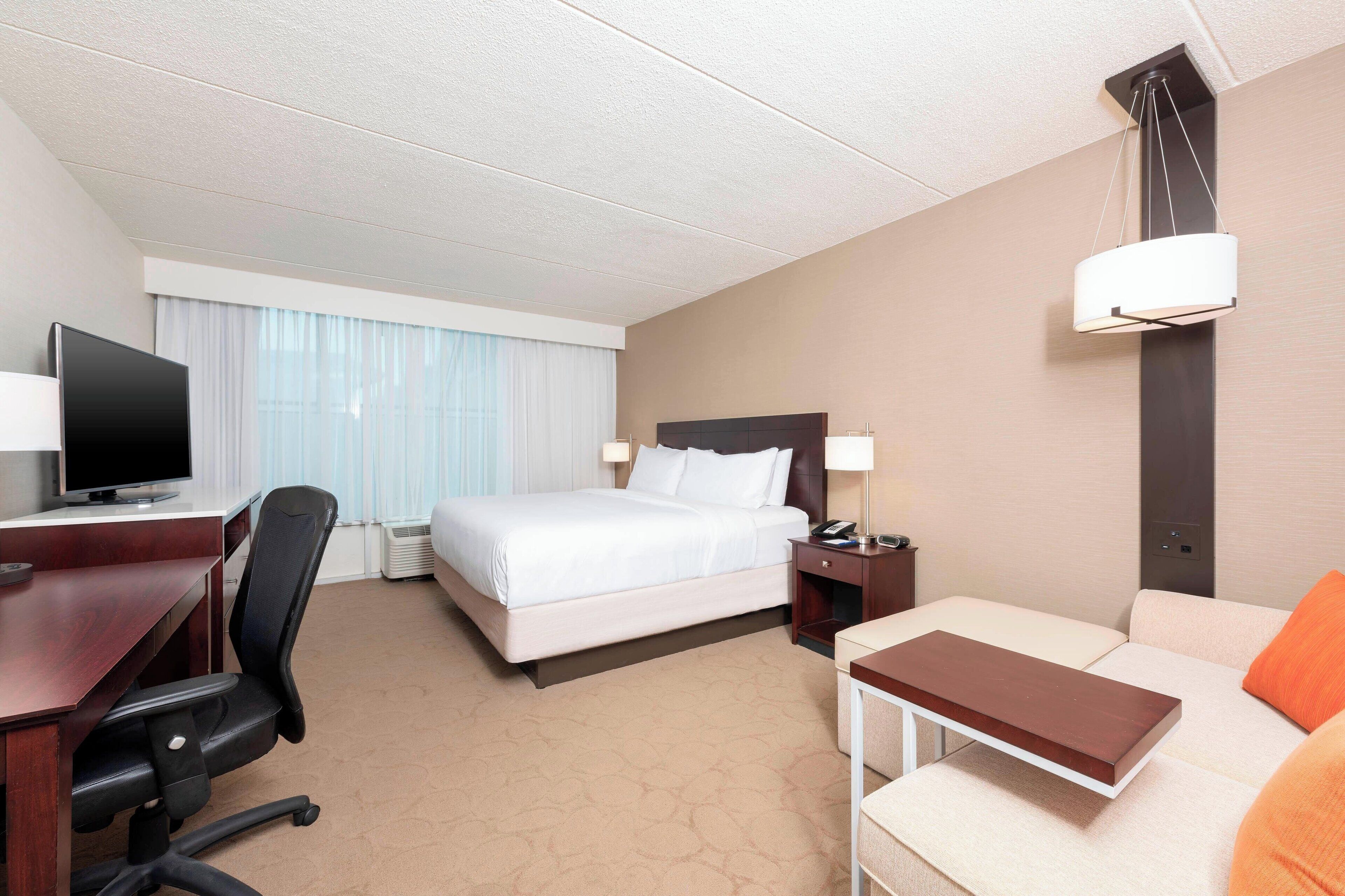 executive room, 1 king bed with sofa bed, non smoking | premium bedding, down duvets, pillow-top beds, in-room safe