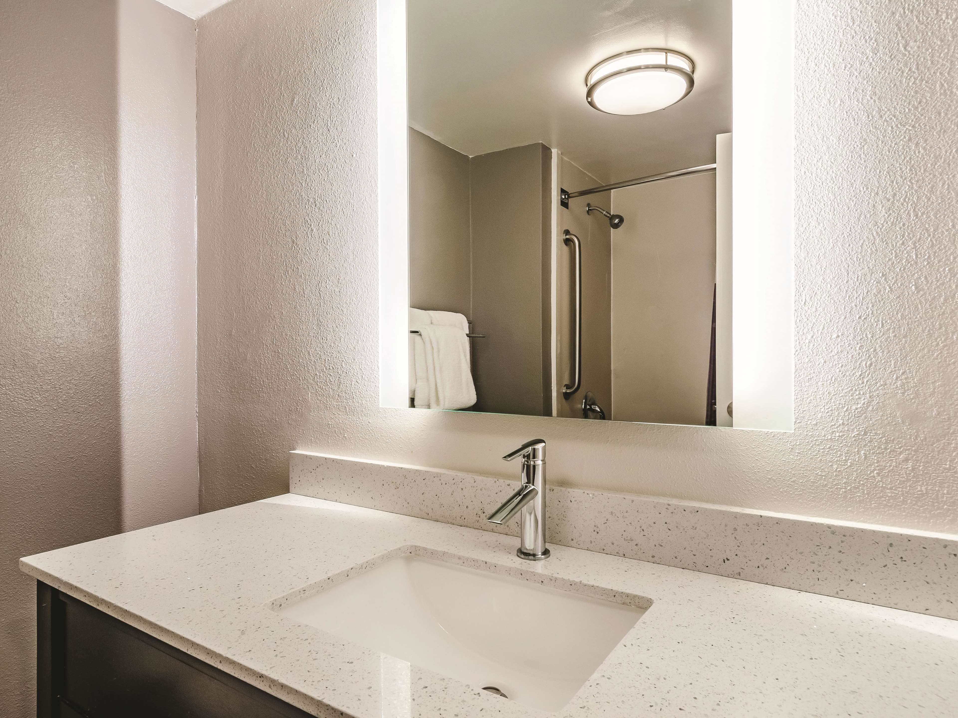 premium bedding, desk, blackout curtains, iron/ironing board