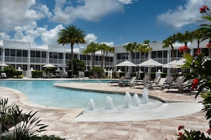 Outdoor pool, open 7:00 AM to 10:00 PM, pool umbrellas, sun loungers