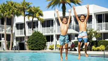 Outdoor pool, open 7:00 AM to 11:00 PM, pool umbrellas, sun loungers