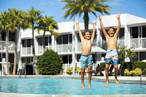Outdoor pool, open 7:00 AM to 11:00 PM, pool umbrellas, pool loungers
