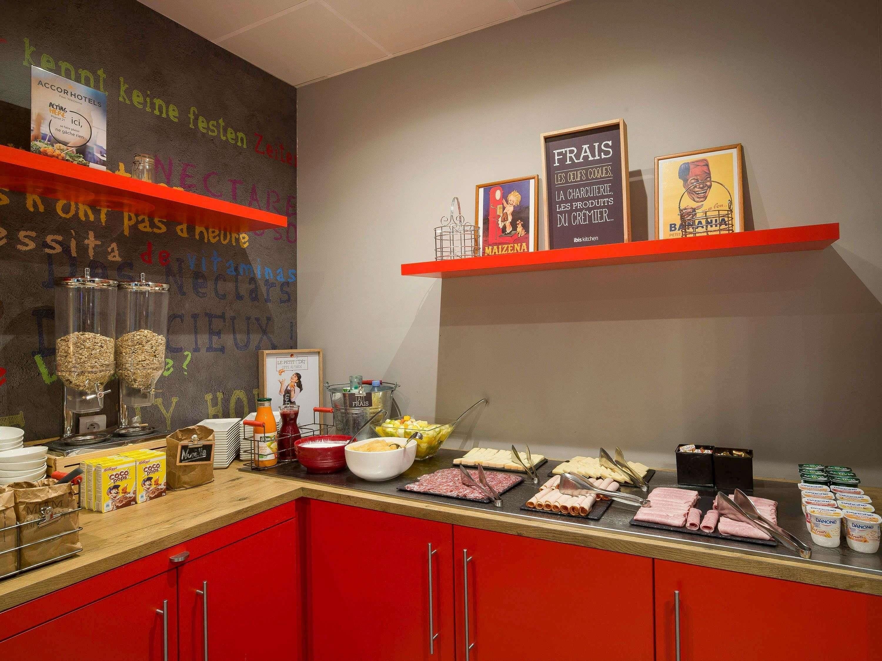 A breakfast buffet with various food items and a chalkboard with messages.