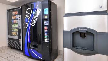 A vending machine area with a 'Cold Drinks' machine and a water dispenser.