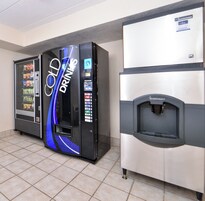 A vending machine area with a 'Cold Drinks' machine and a water dispenser.