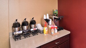A self-service beverage station with Bunn coffee makers, hot water, and condiments. - Red Roof Inn Milwaukee – Airport/Oak Creek (Oak Creek)