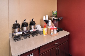 A self-service beverage station with Bunn coffee makers, hot water, and condiments. - Red Roof Inn Milwaukee – Airport/Oak Creek (Oak Creek)