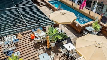 Seasonal outdoor pool, open 9:00 AM to 7:00 PM, pool umbrellas