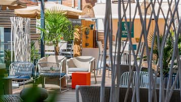 Seasonal outdoor pool, open 9:00 AM to 7:00 PM, pool umbrellas