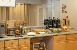 Enjoy cooking and baking in this well-equipped kitchen with a toaster, coffee maker, and ample counter space.