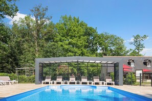 Indoor pool, seasonal outdoor pool, pool umbrellas, pool loungers