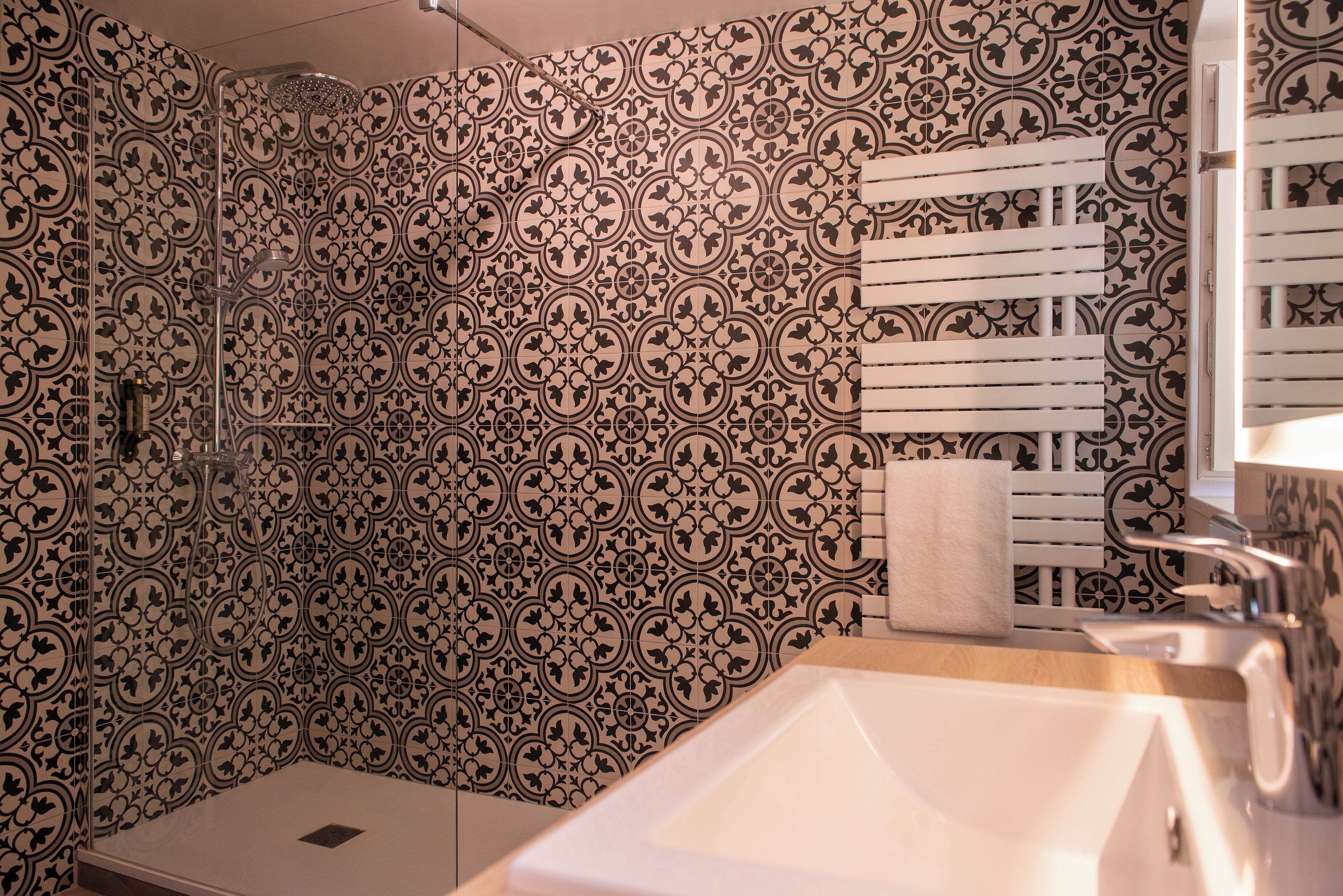 standard double room | bathroom | rainfall showerhead, eco-friendly toiletries, hair dryer, bathrobes