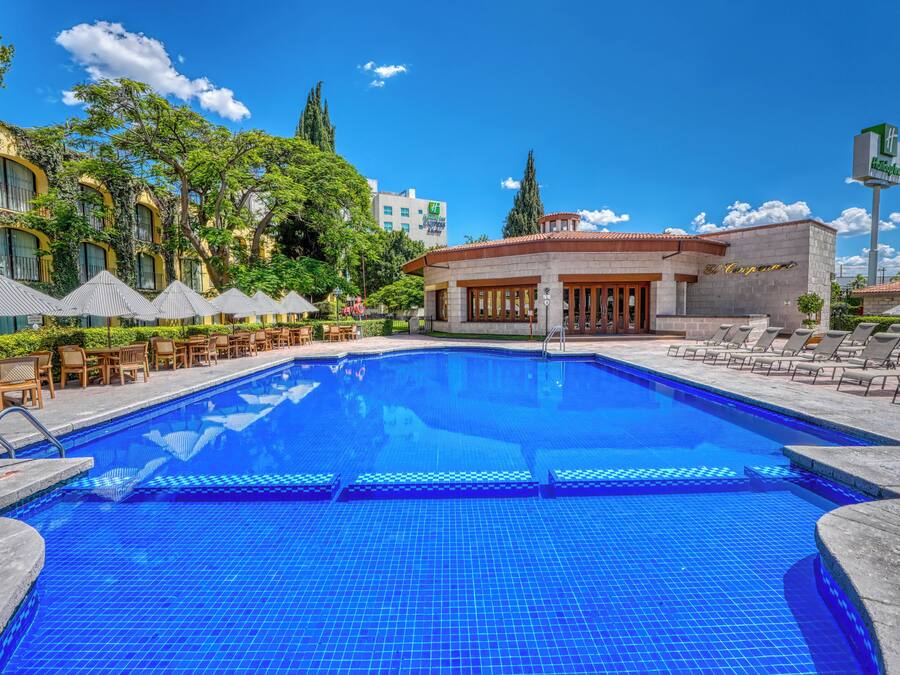 Outdoor pool, open 8:00 AM to 8:00 PM, pool umbrellas, sun loungers