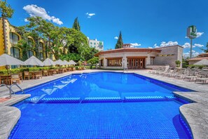 Outdoor pool, open 8:00 AM to 8:00 PM, pool umbrellas, sun loungers