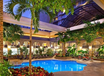 Indoor pool, a heated pool, sun loungers at Courtland Grand Hotel, Trademark Collection by Wyndham