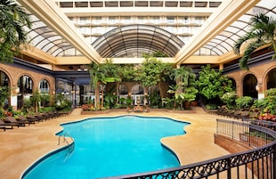 Indoor pool, a heated pool, open 7:00 AM to 10:00 PM, pool loungers