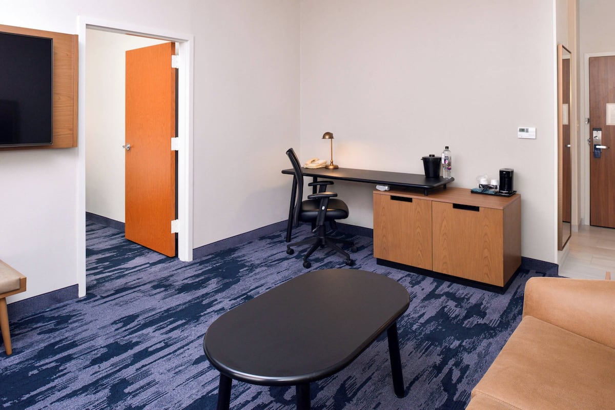 Suite, 1 Bedroom, Non Smoking | Living area | 55-inch flat-screen TV with satellite channels, TV, Netflix