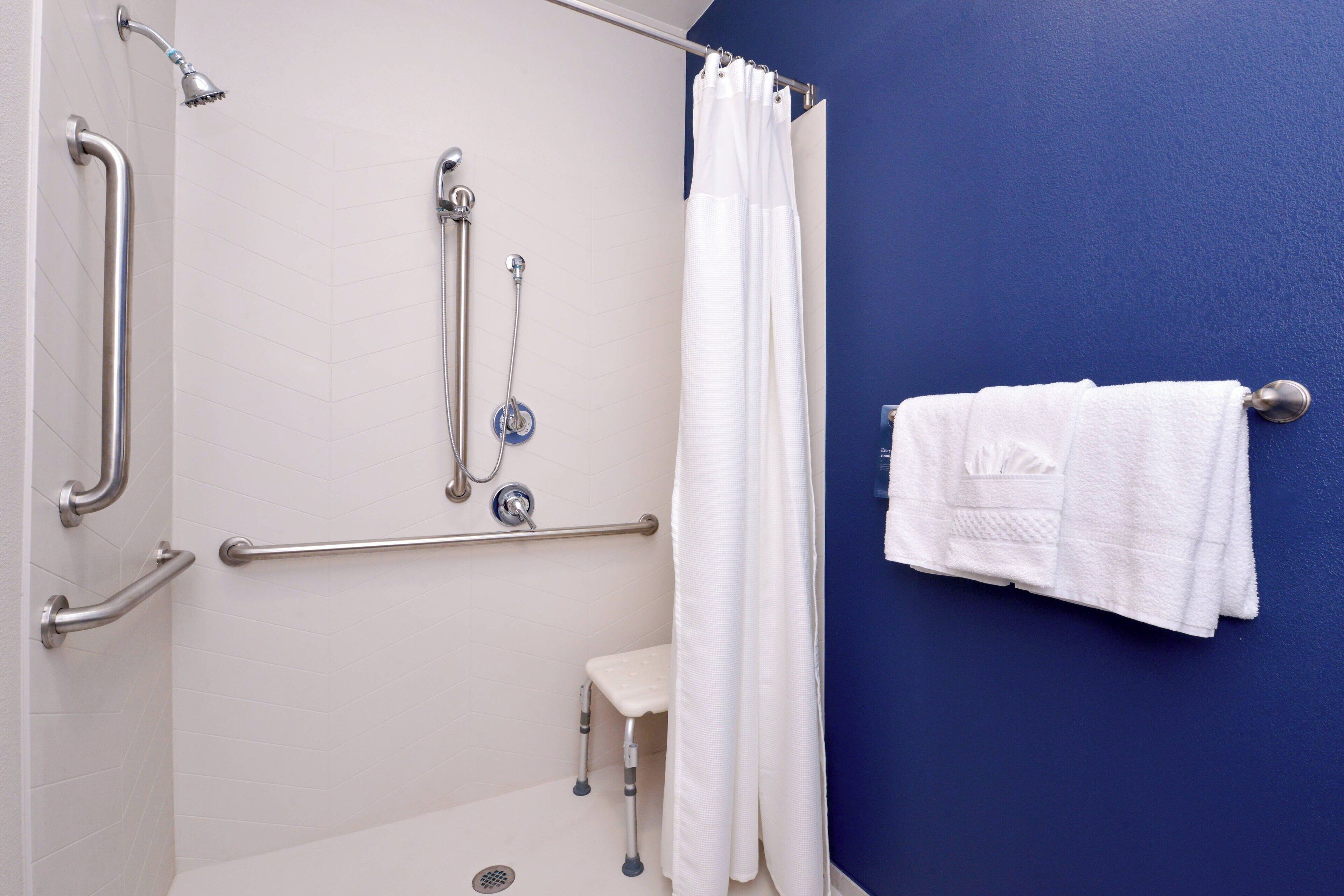 room, 1 king bed | bathroom | shower, eco-friendly toiletries, hair dryer, towels