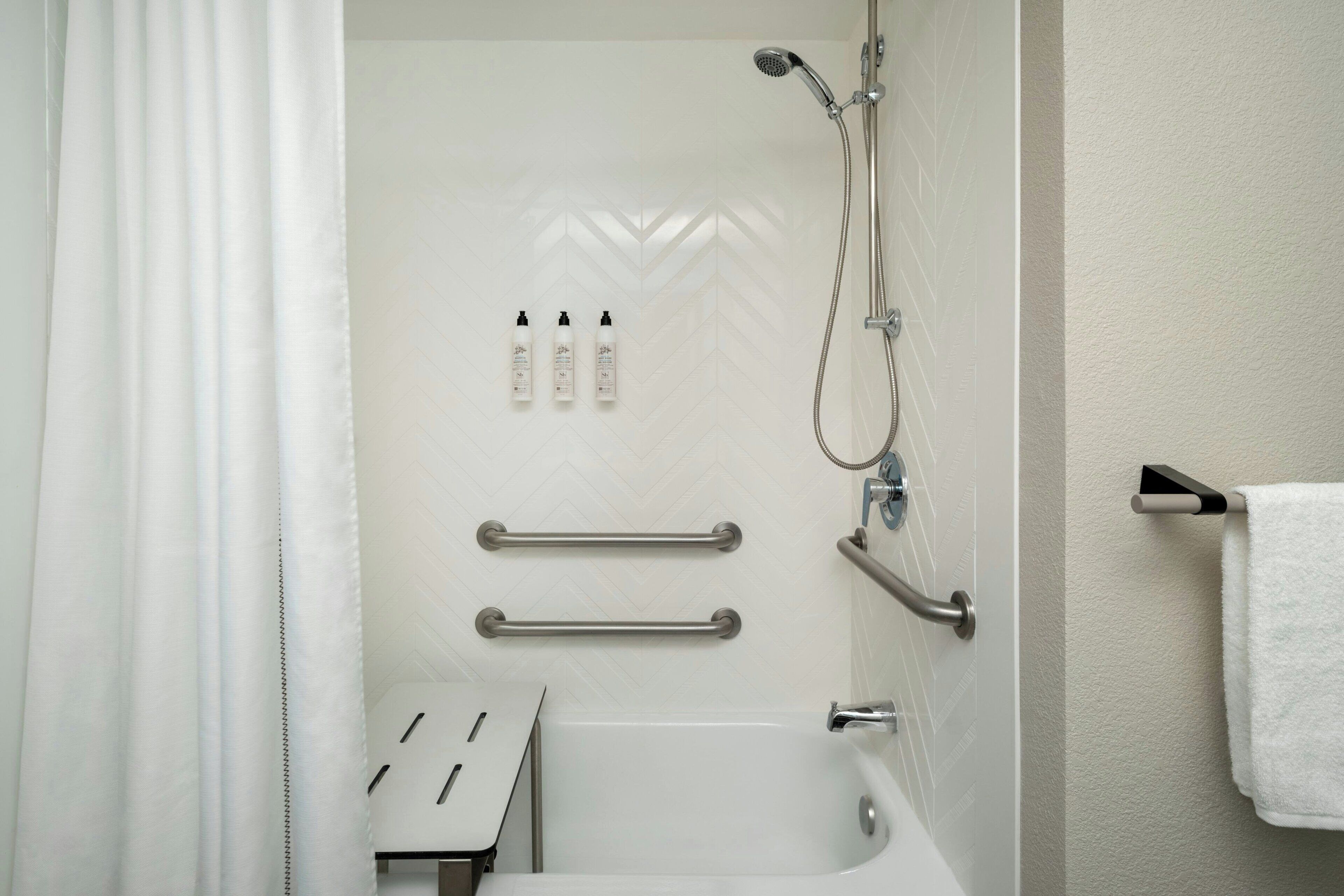 combined shower/bathtub, free toiletries, hair dryer, towels
