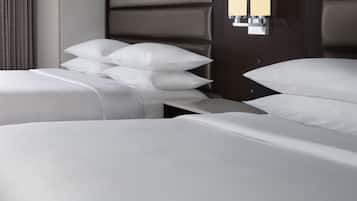 Premium bedding, desk, laptop workspace, blackout drapes