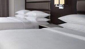 Premium bedding, desk, laptop workspace, blackout drapes