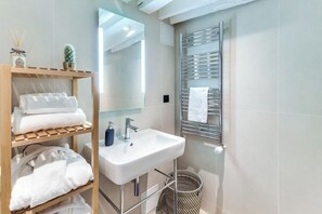 Eco-friendly toiletries, hair dryer, towels