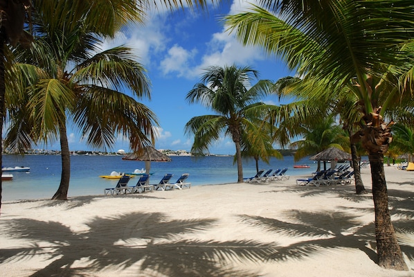 On the beach, sun-loungers, beach umbrellas, beach towels