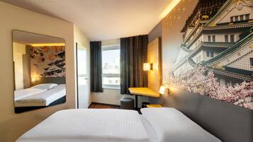 Desk, blackout curtains, soundproofing, free WiFi