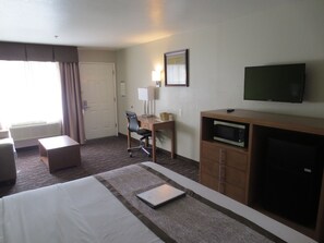 Desk, laptop workspace, blackout drapes, iron/ironing board