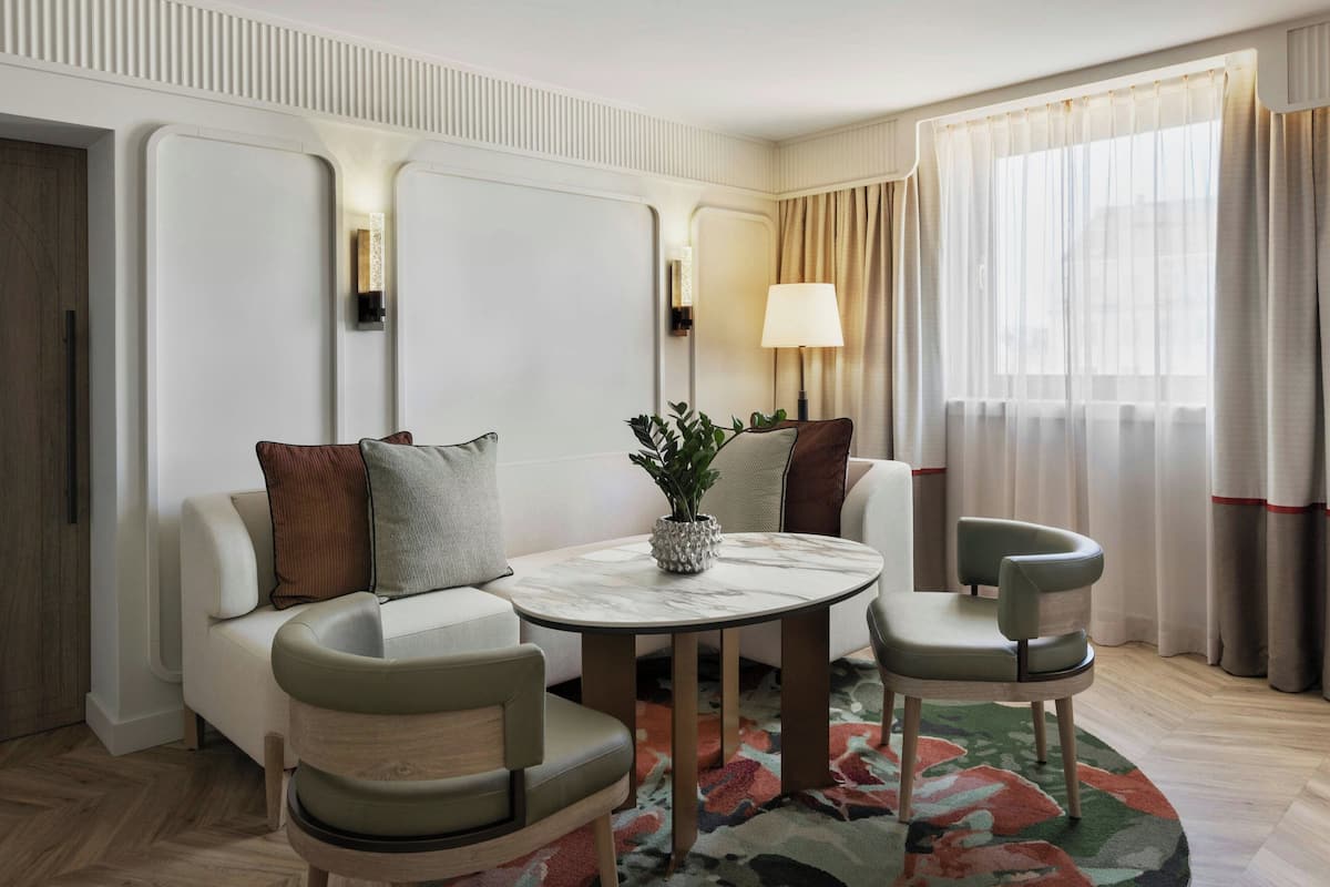 Suite, 1 King Bed, Non Smoking | Living room | 49-inch flat-screen TV with satellite channels, TV, pay movies