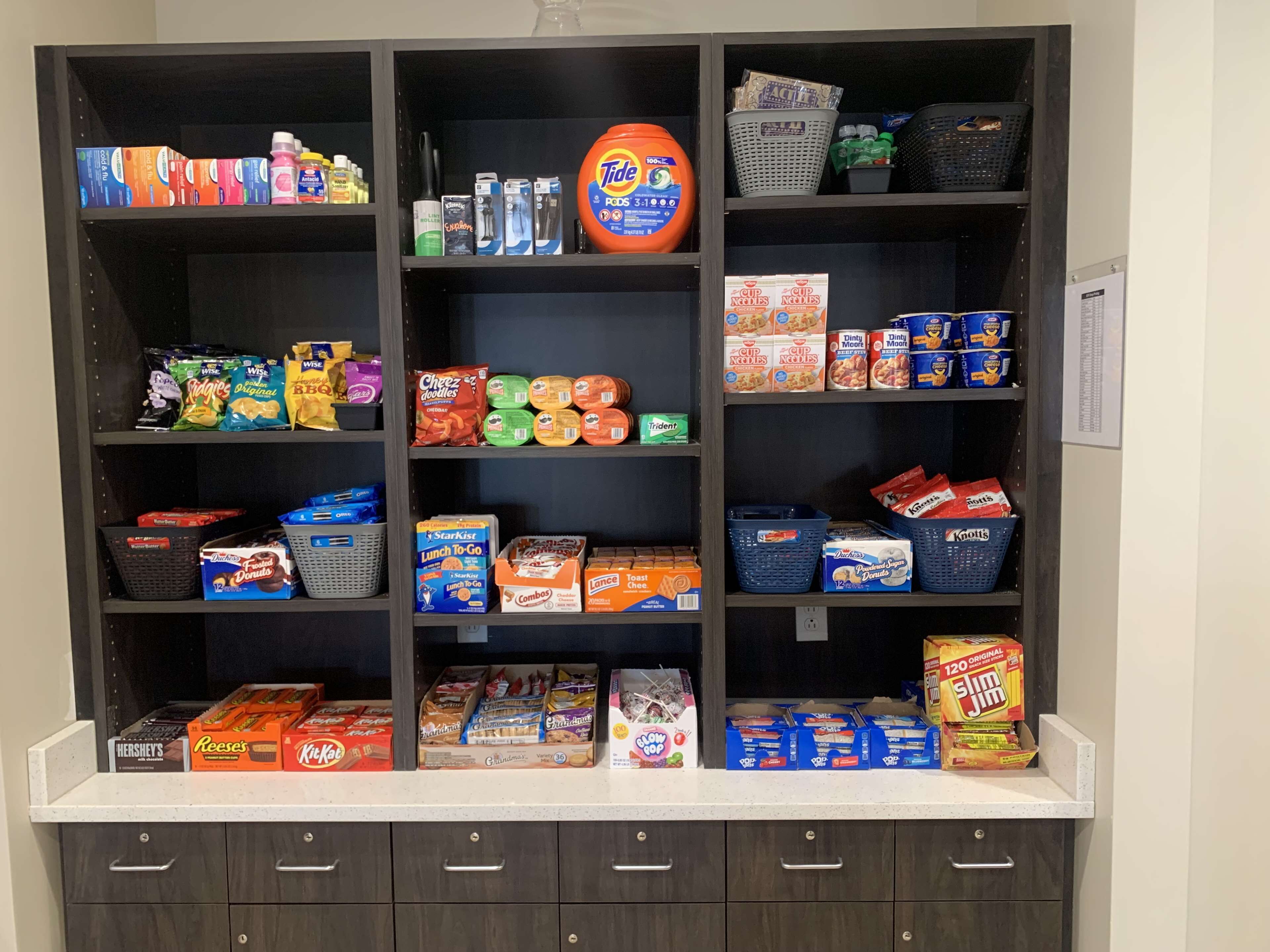A pantry stocked with various food items and household supplies.