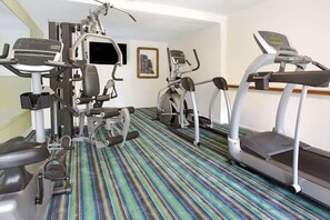 A gym with treadmills, elliptical machines, and weight equipment. - Ramada by Wyndham Fort Lauderdale Airport/Cruise Port (Fort Lauderdale)