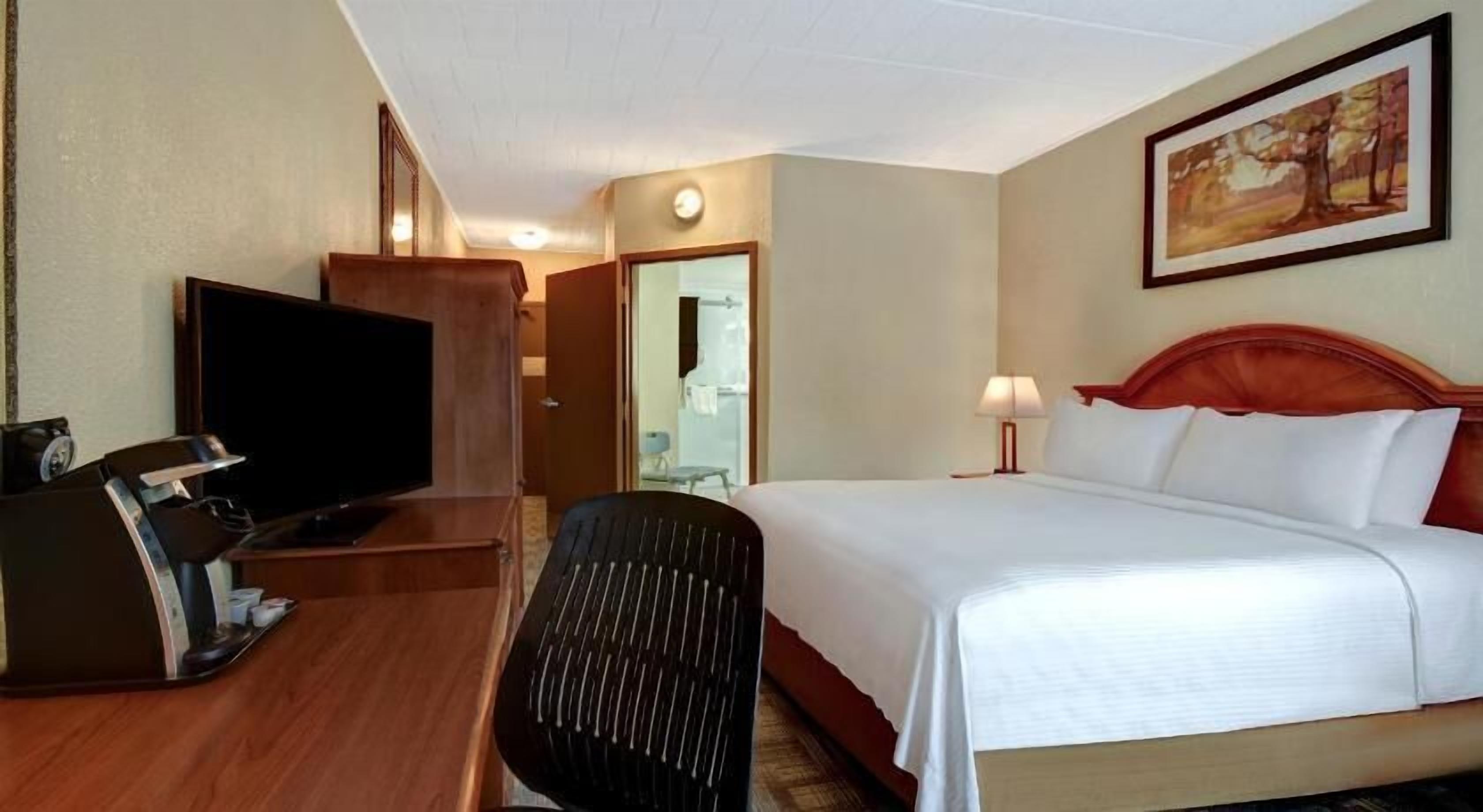 Premium bedding, desk, laptop workspace, iron/ironing board