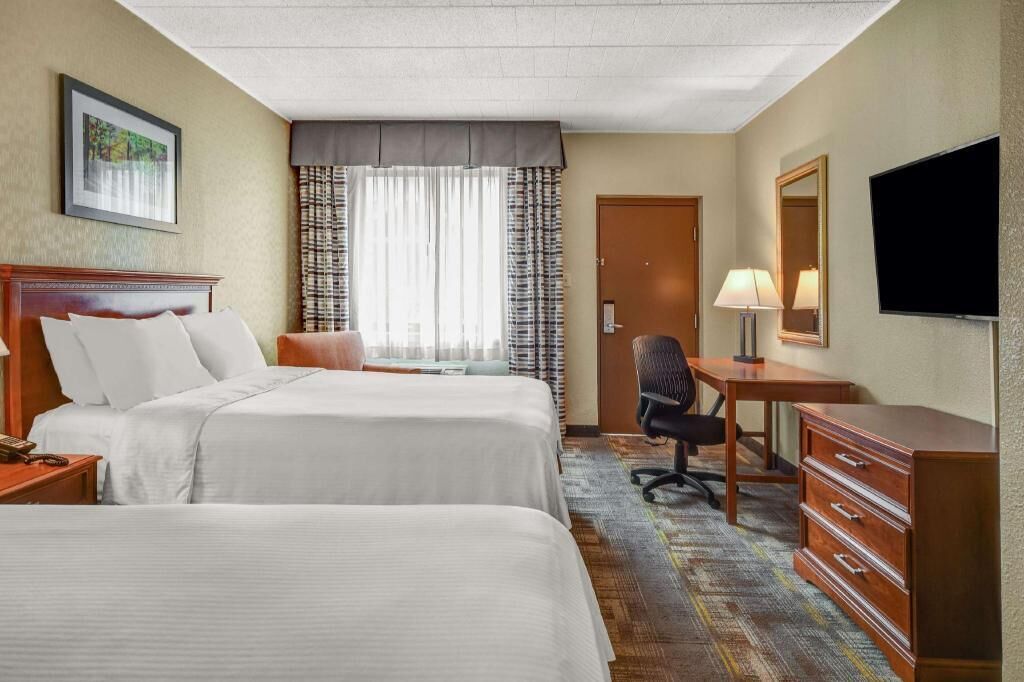 Premium bedding, desk, laptop workspace, iron/ironing board