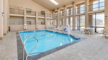 Indoor pool, open 10:00 AM to 10:00 PM, pool loungers