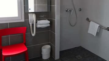 A modern bathroom with a red chair, a towel rack, a toilet, and a shower area.