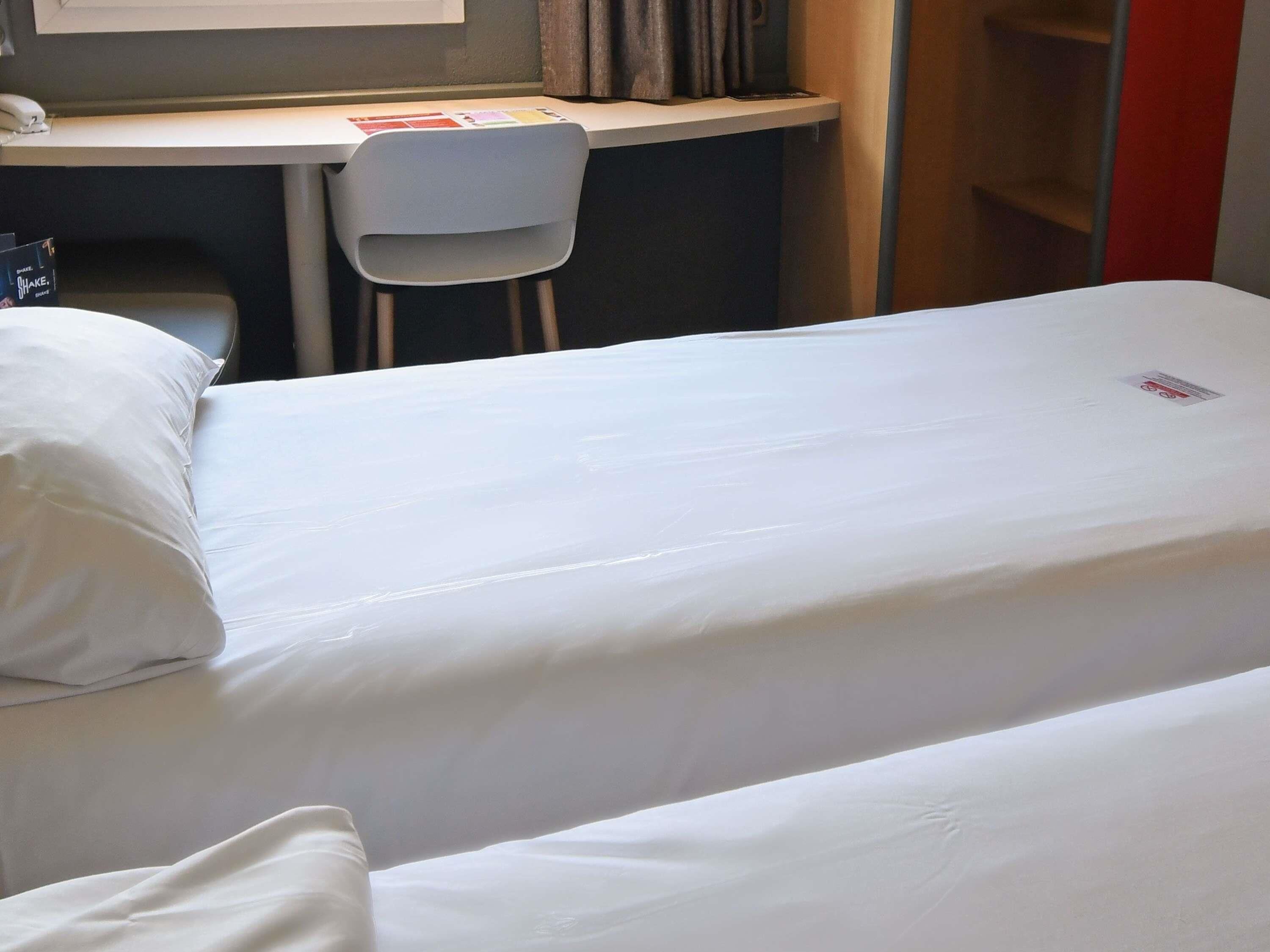 Premium bedding, desk, blackout drapes, soundproofing