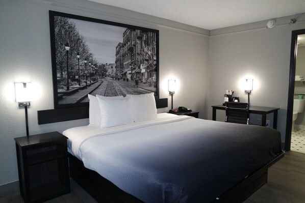 Premium bedding, pillow-top beds, desk, laptop workspace