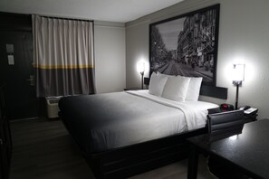 Premium bedding, pillow-top beds, desk, laptop workspace
