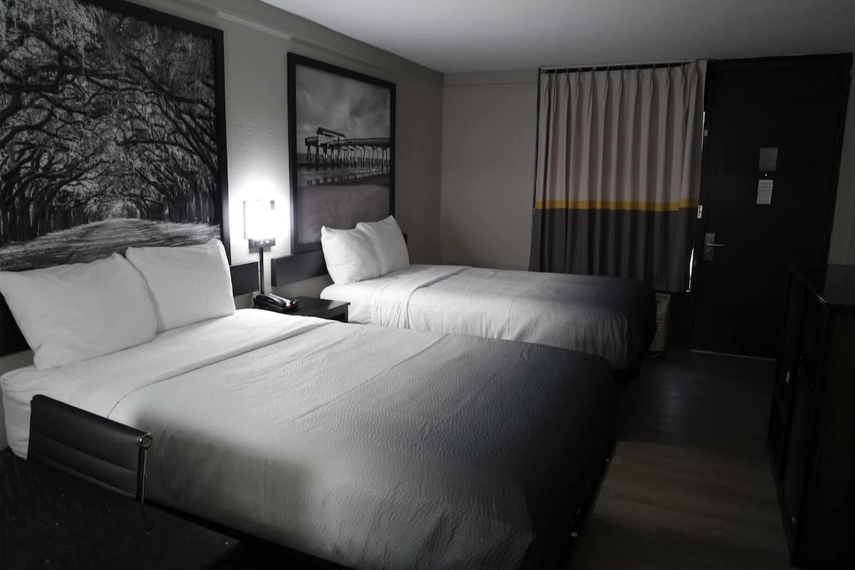 Premium bedding, pillow-top beds, desk, laptop workspace