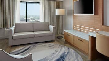 Suite, 1 habitación, para no fumadores | Sala de estar | Televisión de pantalla plana y películas con cargo