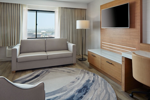 Suite, 1 Bedroom | Living room | Flat-screen TV, pay films